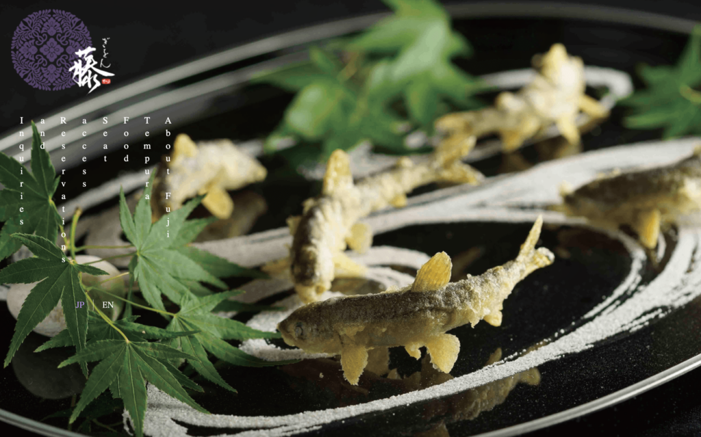 Seasonal ayu river fish tempura plated in traditional kaiseki style at Gion Fukushi in Kyoto, Japan